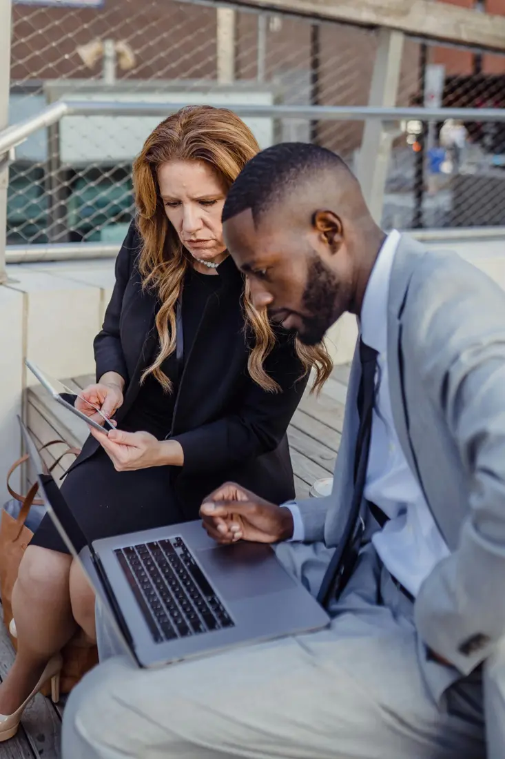 Professionals collaborating on technology in a modern office.